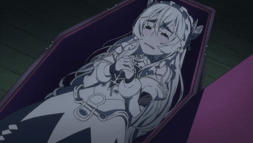 a girl in a white dress is laying in a coffin with her eyes closed