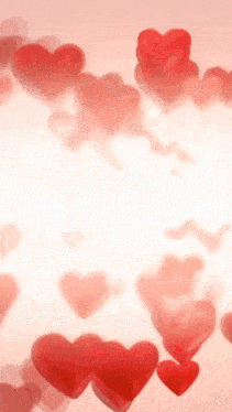 a bunch of red hearts floating in the air