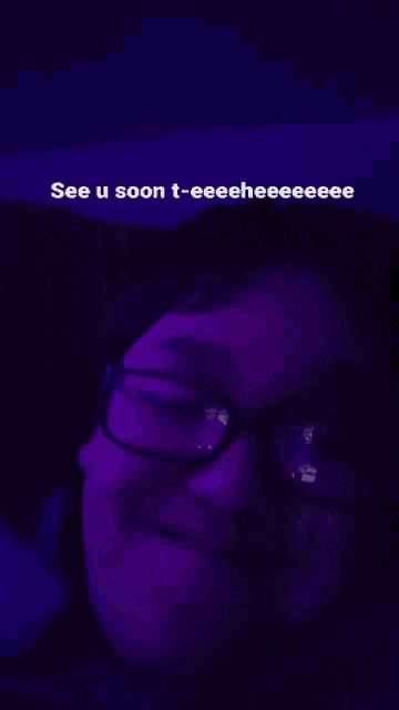 a person wearing glasses with the words see u soon t-eeeeheeee