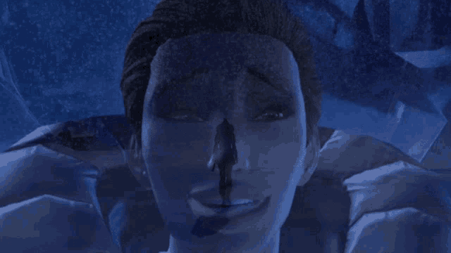 a close up of a person 's face with a slight smile