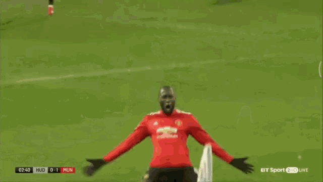 a soccer player in a red jersey with the number 39 on it