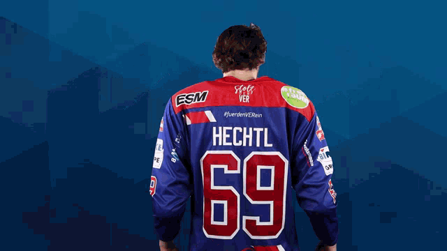 a man in a purple jersey with the number 69 on it