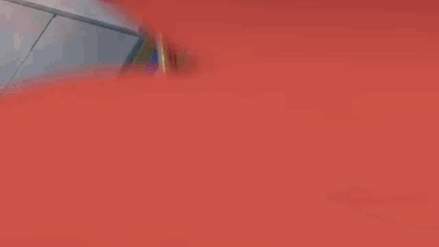 a couple of anime characters are standing on a balcony .