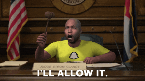 judge strom clancy is holding a gavel in a courtroom