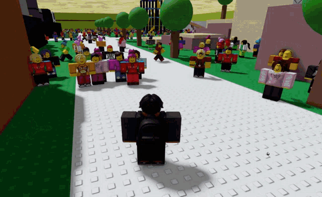 a person standing in front of a crowd of people in a video game