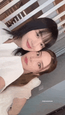 two women are posing for a picture and one of them has a red lip