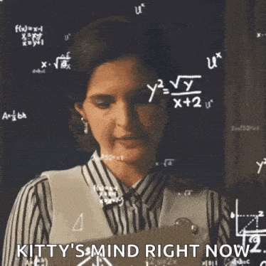 a woman is standing in front of a blackboard with mathematical equations on it .