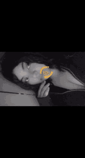 a black and white photo of a woman with a yellow sticker on her face that says ' i 'm sorry '