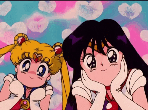 sailor moon and mars are standing next to each other and smiling