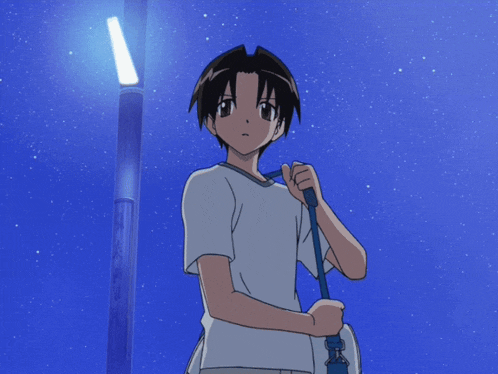 a boy in a white shirt holding a blue bag