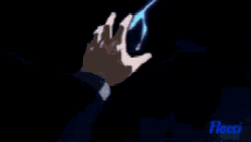 a person wearing a white glove is holding a blue object .