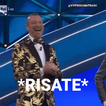 a man in a suit and bow tie is laughing and says * risate * on the screen