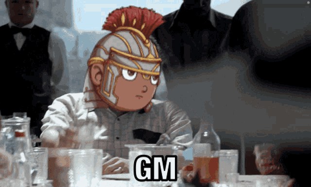 a man in a roman helmet sits at a table with the word gm above him