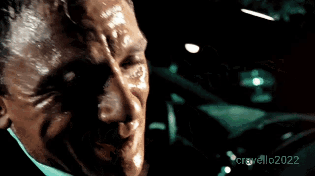 a close up of a man 's face with the year 2022 on the bottom right corner