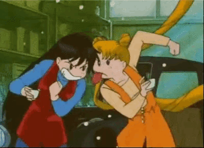 a couple of cartoon characters standing next to each other fighting