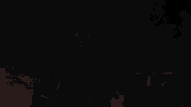 a man is holding a red light saber in the dark