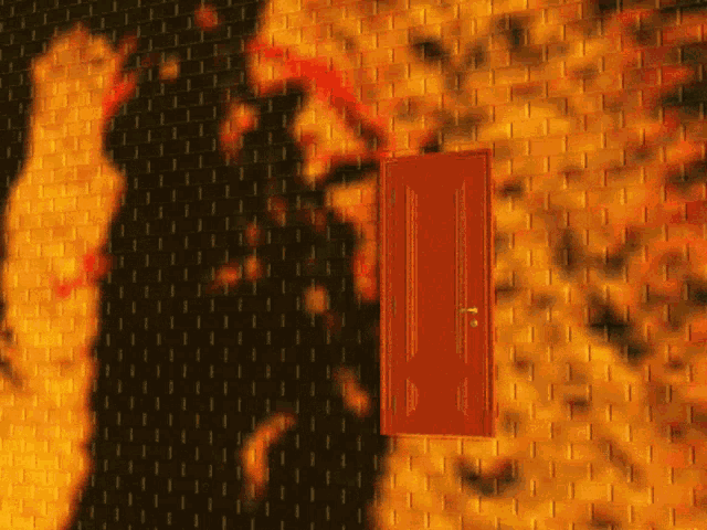 a red door is against a brick wall