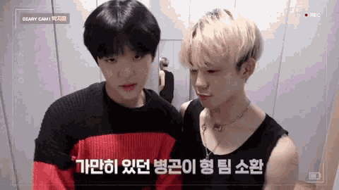 a couple of young men standing next to each other with the words diary cam on the screen