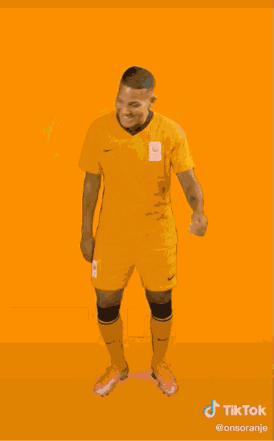 a group of soccer players are jumping in the air with their arms in the air