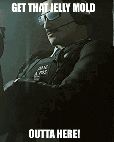 a picture of a man with glasses and a headset with the caption get that jelly mold outta here