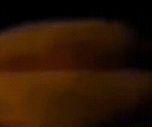 a blurred image of a person 's hand with a black background