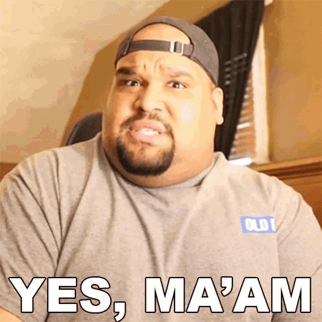 a man wearing an old navy shirt says yes ma ' am