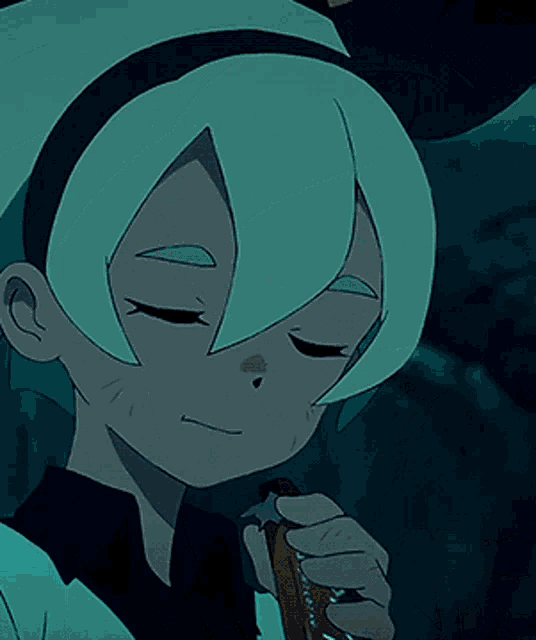 a close up of a person 's face with their eyes closed holding a piece of bread
