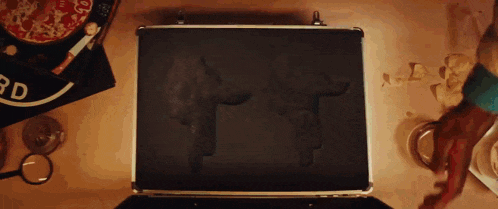 two guns are in a briefcase on a table