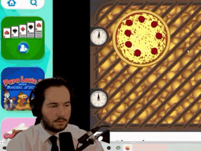 a man playing a game with a pizza in the middle