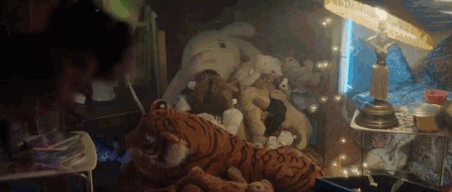 a bunch of stuffed animals including a tiger