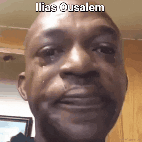 a close up of a man 's face with the caption ilias ousalem