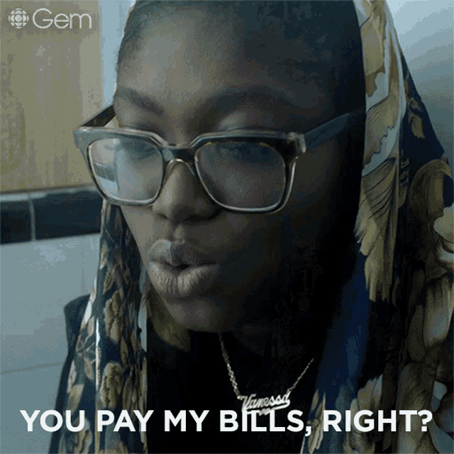 a woman wearing glasses and a vanessa necklace asks if she should pay her bills
