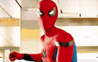 a close up of a person wearing a spiderman costume .