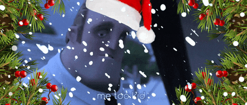 a man wearing a santa hat is surrounded by snow