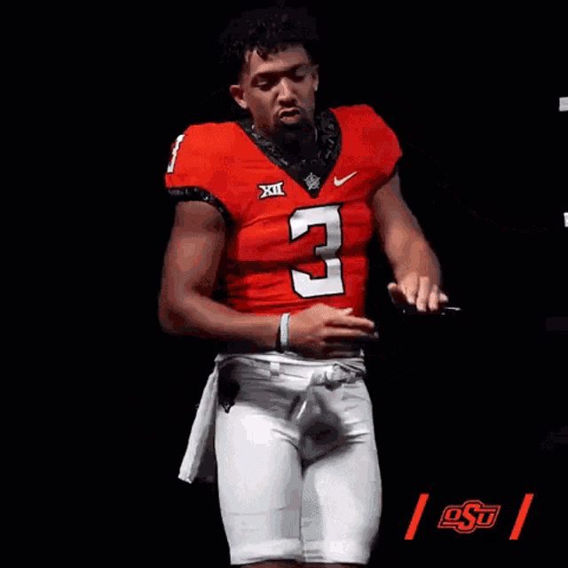 a football player with the number 3 on his shirt