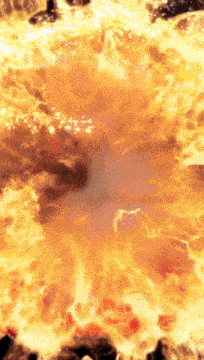 a circle of fire is surrounded by rocks and looks like a volcano