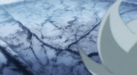 a close up of a blue surface with a few spots of white