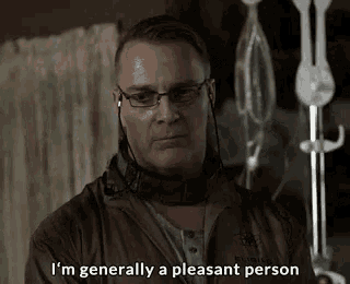 a man wearing glasses and ear buds is saying i 'm generally a pleasant person .