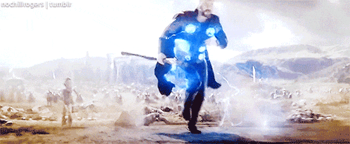 thor is running with a hammer in his hand in a battle scene from avengers : age of ultron .