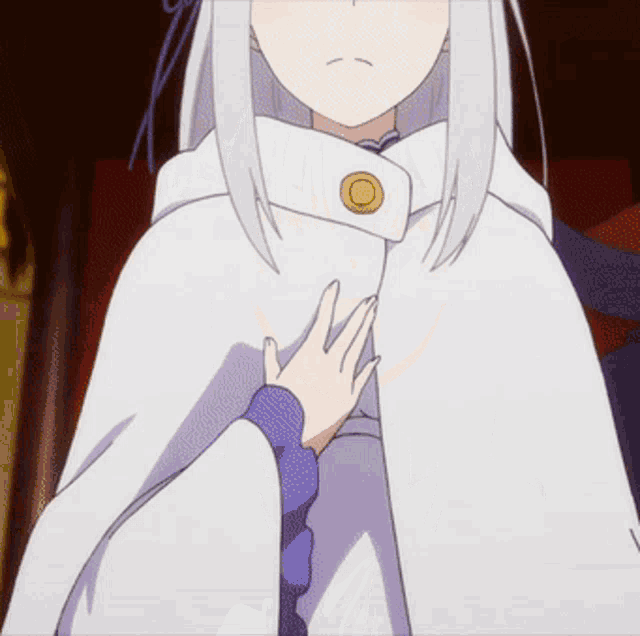 a girl with white hair is wearing a white cape with a button on the front