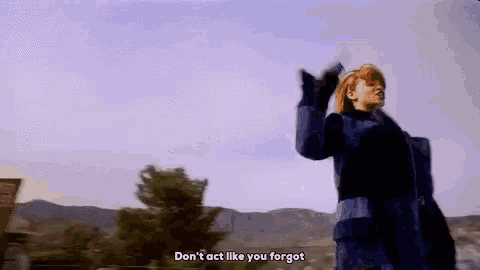 a woman in a blue coat is holding a gun in her hand and says `` don t act like you forgot '' .