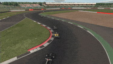 three race cars are on a track with a crowd watching
