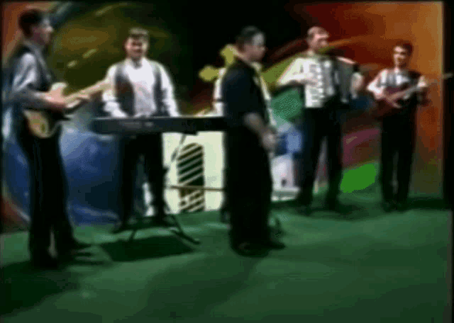 a group of men are playing musical instruments in front of a sign that says n