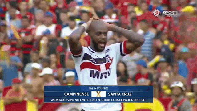 a soccer player celebrates a goal during a match between campinense and santa cruz