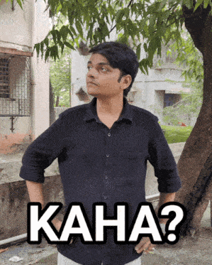 a man in a black shirt is standing in front of a tree with the words kaha written on the bottom