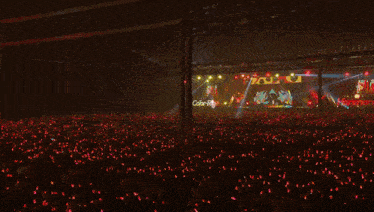 a girl in a red and white outfit with the word run on her chest is standing on a stage