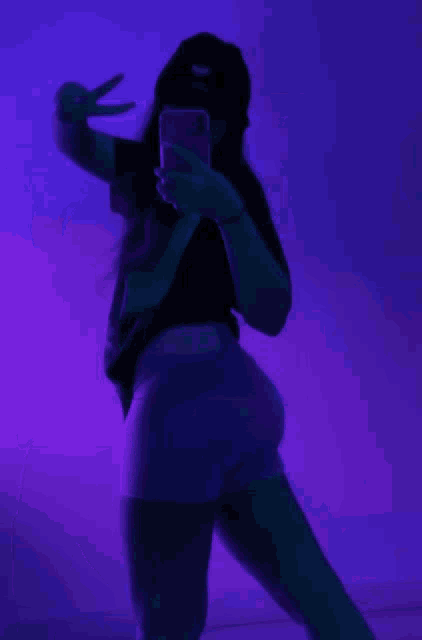 a woman is taking a picture of herself with her phone