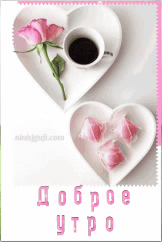 a heart shaped plate with a cup of coffee and pink roses
