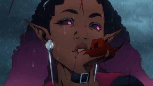 a close up of a woman 's face with blood on her face