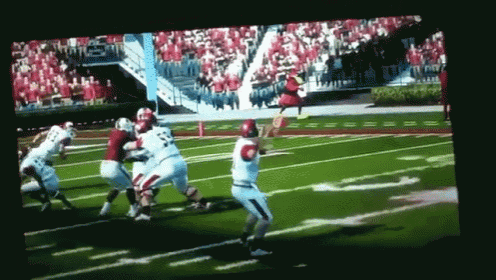 a football game is being played in a stadium with a player wearing number 23